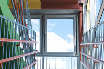 A fragment of a flight of stairs with windows