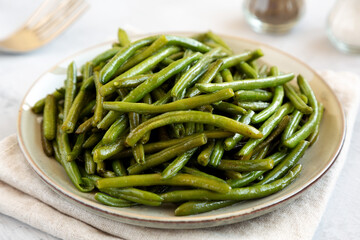 Homemade Sauteed Green Beans on a Plate, side view.
