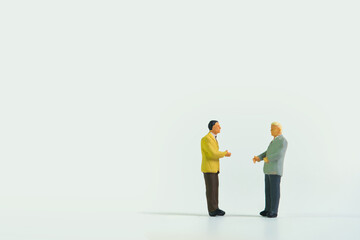 Business people agree on a deal with a handshake, isolated on white background