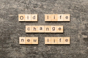 old life change new life word written on wood block. old life change new life text on table, concept
