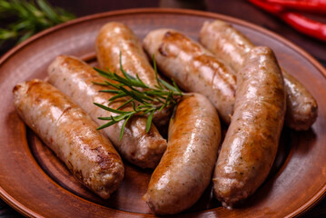 Roasted sausages grill with spices and herbs with salt and pepper