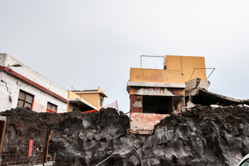Building destroyed by the volcanic lava flow from the Cumbre Vieja volcano, on the island of La...