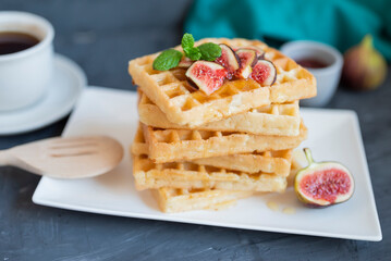 sweet breakfast Belgian waffles with honey and figs