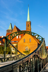 Panoramic view of Ostrow Tumski Island with Holy Cross collegiate cathedral and Most Tumski Bridge over Odra river in historic old town quarter of Wroclaw in Poland