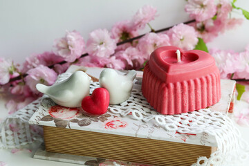 valentine's day background. handmade soy candle made of natural soy wax in the shape of a red heart