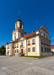 Fototapeta na wymiar Classicist Town Hall Ratusz Miejski at Rynek Market Square in historic old town quarter of Swiebodzice in Silesia region of Poland