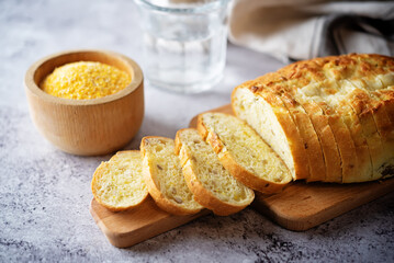Corn wheat white bread with glasses of water