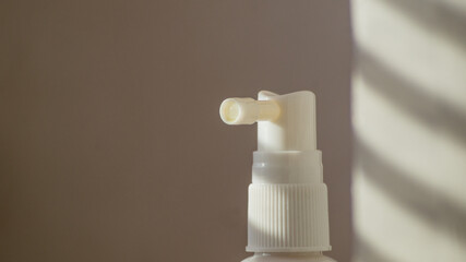 close up of white bottle of medical spray for the throat