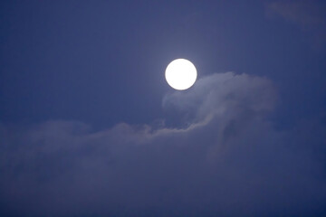 Obraz na płótnie Canvas Moon in the sky with a cloud