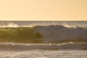 Sunset Surfing in the waves