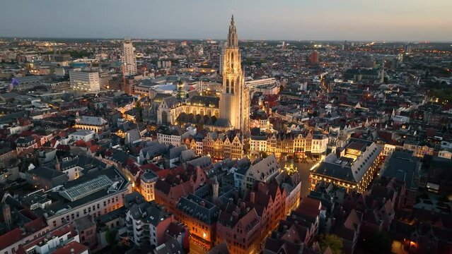 4K Aerial view of cityscape of Antwerp, gothic style landmark Cathedral of Our Lady Antwerp and historic center of city Belgium from above, Europe at night