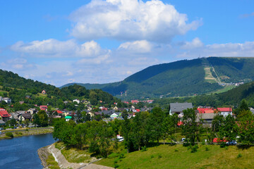 Fototapeta premium Summer lanscape view from Tresna Dam to Beskid mountains with Sola river and Zar Mount, Poland