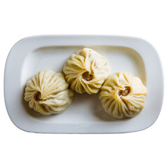 Mongolian buuz on white plate isolated on white background top view