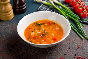 mastava Uzbek cuisine on white bowl on dark stone table