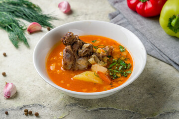 shurpa asian soup with beef on white bowl