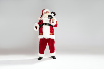  Full length photo of real Santa Claus doing fit exercise. Christmas time. Xmas vibes. A lot of copy space