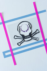 skull head and crossbones with circle on forehead and frame by paper lines