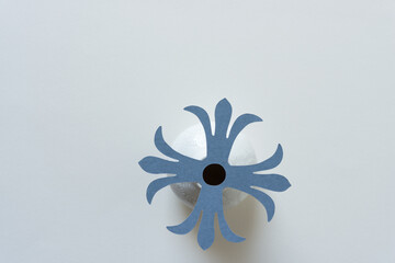decorative rosette isolated on a white vase and blank paper
