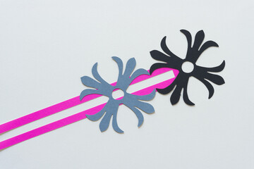 two decorative rosettes and paper box