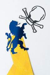 blue heraldic lion glyph or dingbat and skull and crossbones silhouettes and yellow element