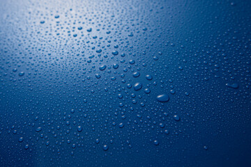 Naklejka na ściany i meble Wet surface with water drops