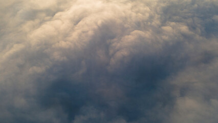 Sunrise and Horizon over a clouds, aerial view