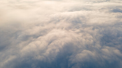 Sunrise and Horizon over a clouds, aerial
