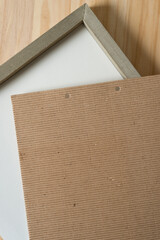 wood frame and white panel with corrugated paper on top