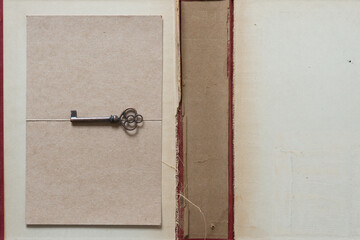 old hardcover book case with decorative key