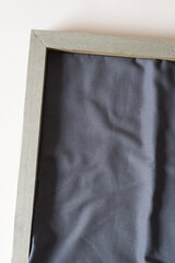 wood frame with gray fabric