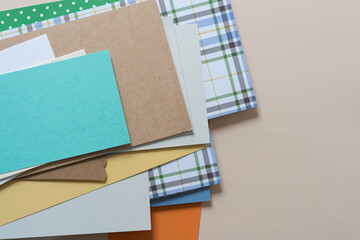 background with random pile of scrapbook and plain papers