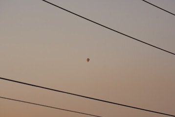 A hot air ballon between power chords 