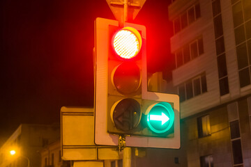 Traffic light in the city center in the evening.