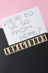 "where do we go from here?" and the word "armageddon" on black and pink paper embossed with the word "love"