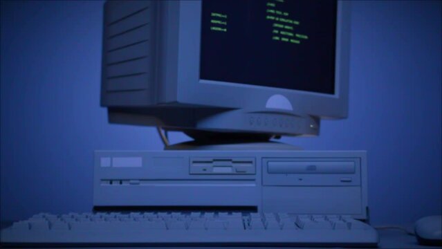 Retro pc with loading code console, programmer making scripts, green basic screen, Old computer studio blue night background close-up, Desktop vintage retro wave display, late 90s PC.