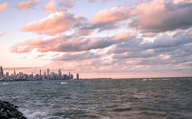 Chicago city on Michigan lake during sunset with colorful clouds
