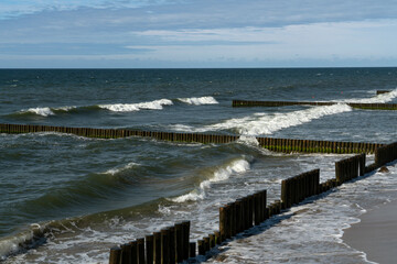 View of the Baltic Sea and wooden breakwaters of the city beach on a summer day, Svetlogorsk, Kaliningrad region, Russia