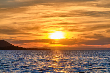 Sunset on Lake Baikal in the Barguzin Bay. Republic of Buryatia, Maksimikha settlement.