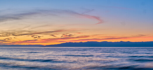Sunset on Lake Baikal in the Barguzin Bay. Republic of Buryatia, Maksimikha settlement.