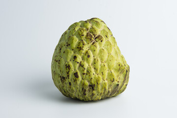 sugar apple ( srikaya ) with black spots, isolated on a white background, sugar apple fruit tastes sweet, grows in the tropics. can be eaten directly when it is ripe or can be processed first.