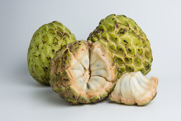 sugar apple ( srikaya ) with black spots, isolated on a white background, sugar apple fruit tastes sweet, grows in the tropics. can be eaten directly when it is ripe or can be processed first.