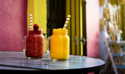 Fresh smoothies on a wooden table in a restaurant. Healthy drinks.