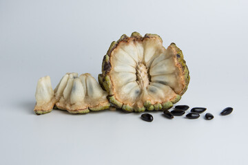 sugar apple ( srikaya ) with black spots, isolated on a white background, sugar apple fruit tastes sweet, grows in the tropics. can be eaten directly when it is ripe or can be processed first.