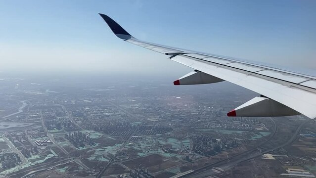 Plane wing view over India.