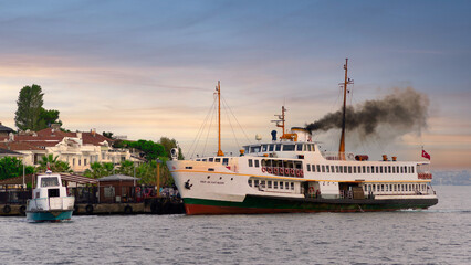 Modern ferry boat departing Kinaliada Island Ferry Terminal in Marmara sea at dawn, near Istanbul, Turkey