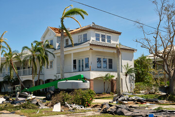 Destroyed by hurricane Ian expensive house in Florida residential area. Consequences of natural...