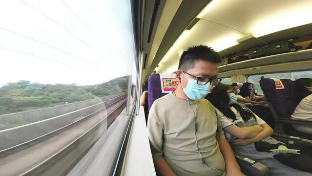 young businessman traveling on high speed train