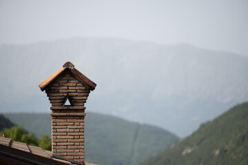 chimney before a mountain in the morning