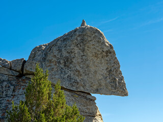 A rock balanced precariously on top of a formation at Castle Rocks State Park, Idaho, USA