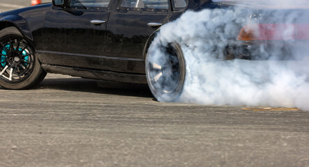 Race drift car burning tires on speed track © toa555